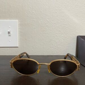 Elegant Gold Oval Sunglasses
